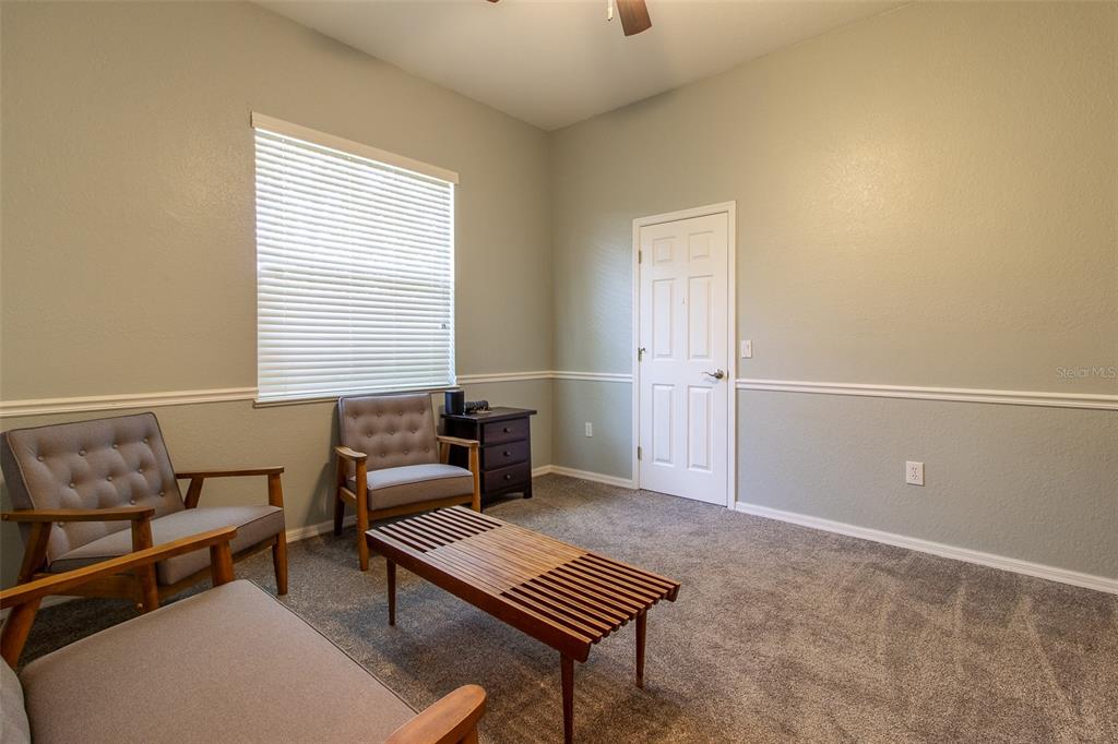8950 Southeast 17th Court Ocala, FL 34480 - Photo 28 of 61 a living room with furniture and a window