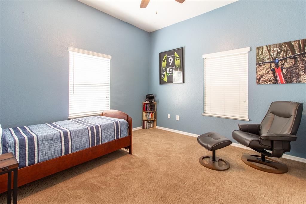 8950 Southeast 17th Court Ocala, FL 34480 - Photo 31 of 61 a bedroom with a bed and a window