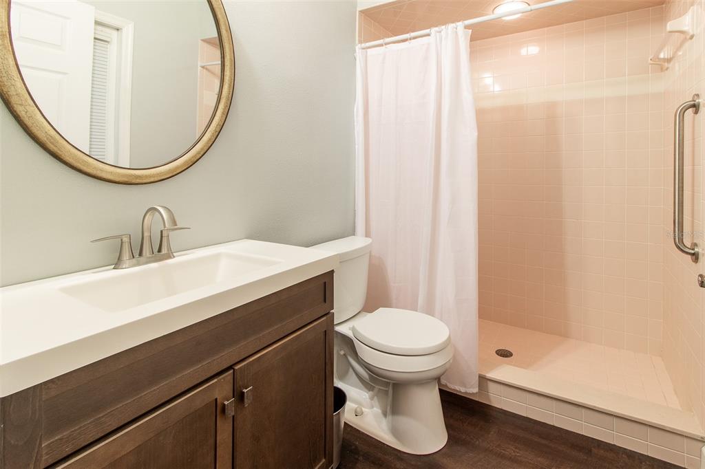 8950 Southeast 17th Court Ocala, FL 34480 - Photo 33 of 61 a bathroom with a sink toilet and shower
