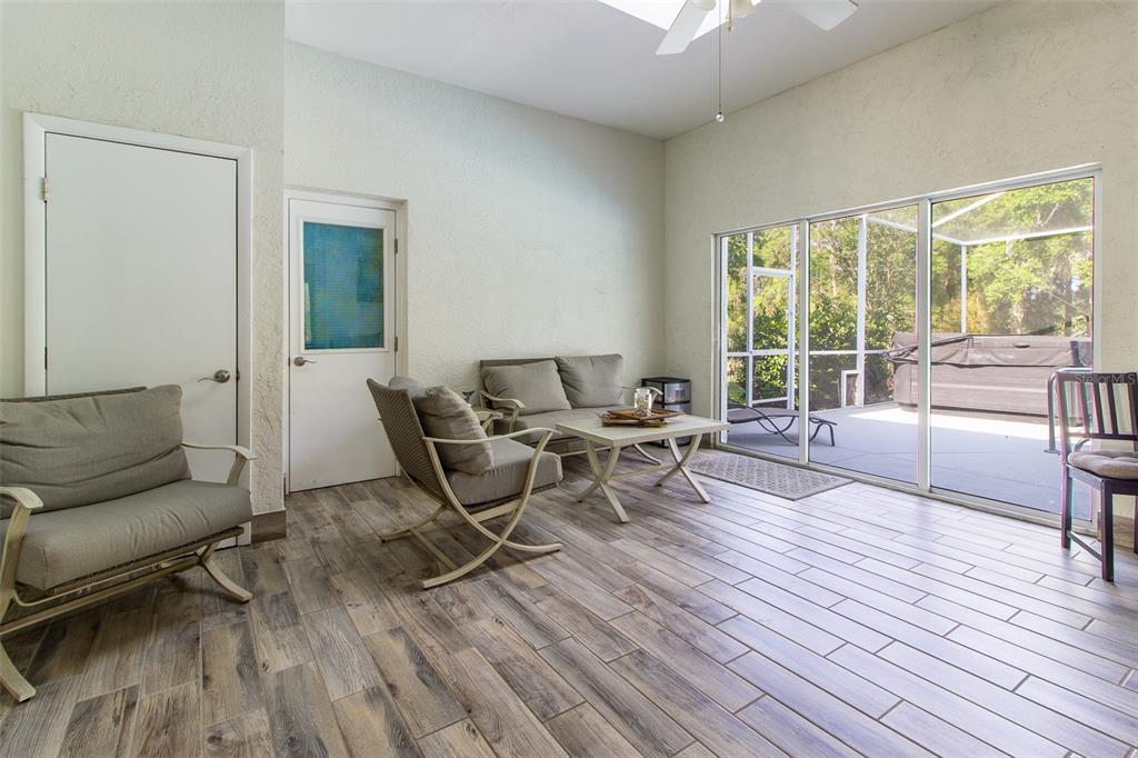 8950 Southeast 17th Court Ocala, FL 34480 - Photo 38 of 61 a living room with furniture and a wooden floor