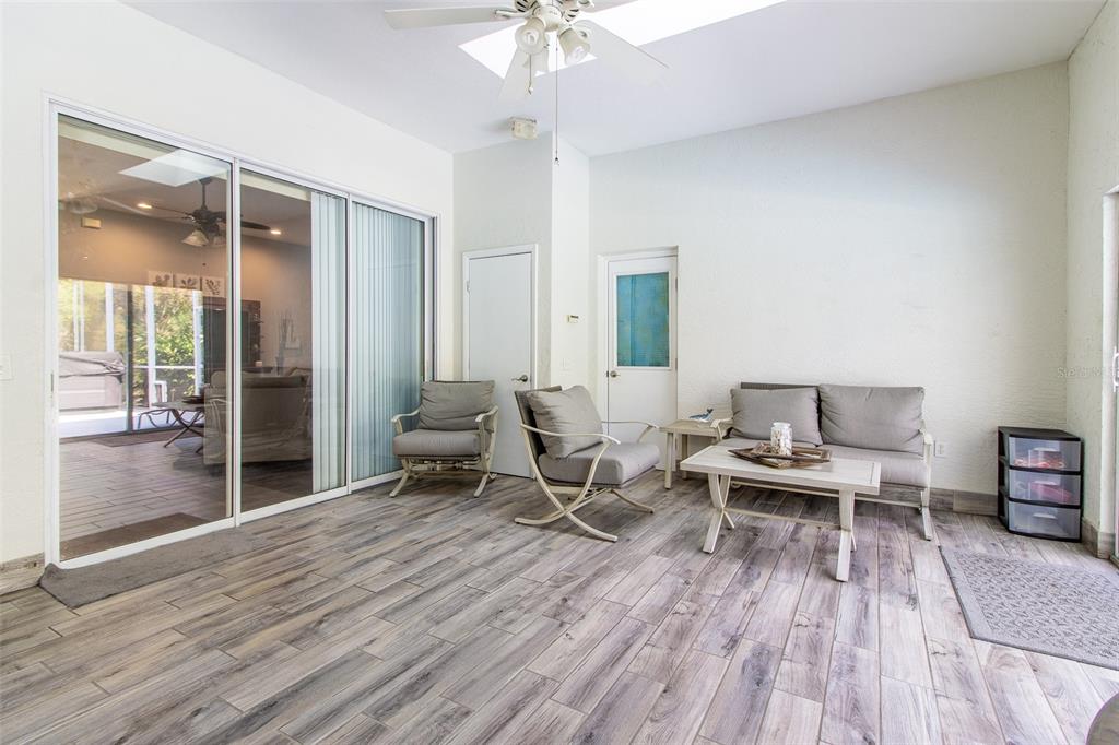 8950 Southeast 17th Court Ocala, FL 34480 - Photo 40 of 61 a living room with furniture and a wooden floor