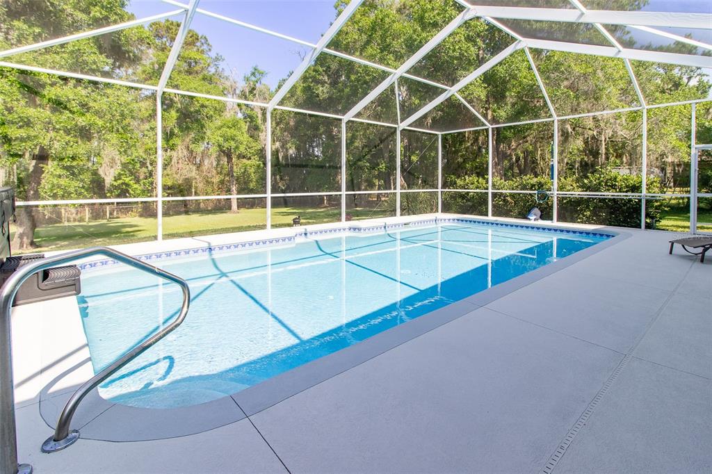 8950 Southeast 17th Court Ocala, FL 34480 - Photo 42 of 61 a view of a tennis court with a large window