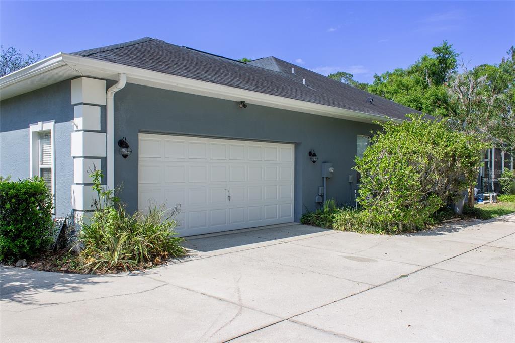 8950 Southeast 17th Court Ocala, FL 34480 - Photo 47 of 61 a front view of a house with garden