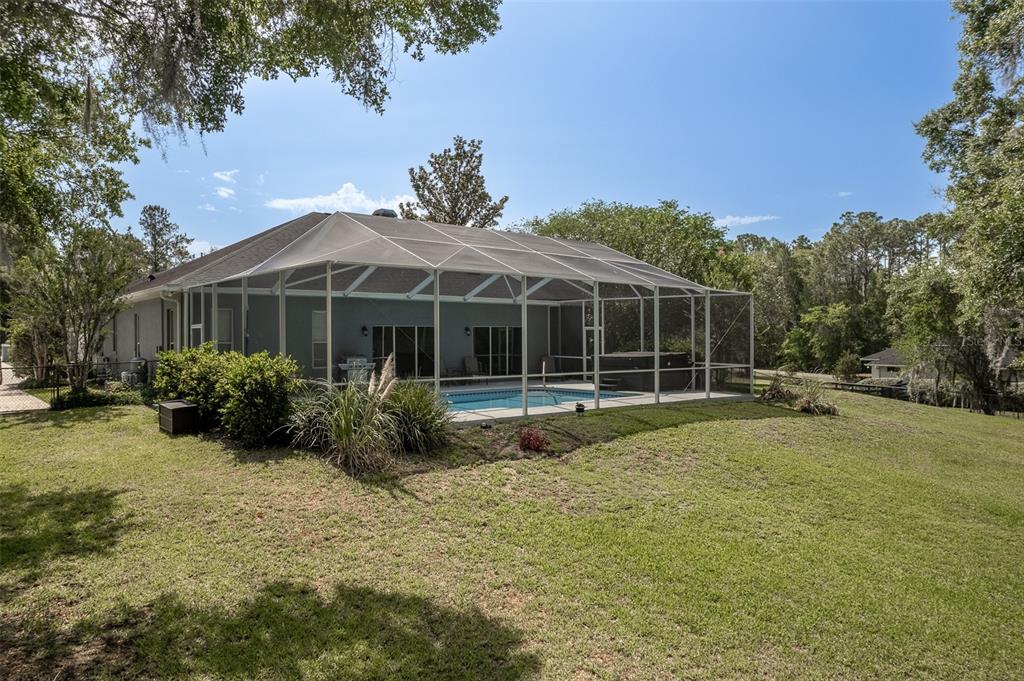 8950 Southeast 17th Court Ocala, FL 34480 - Photo 48 of 61 a front view of a house with garden