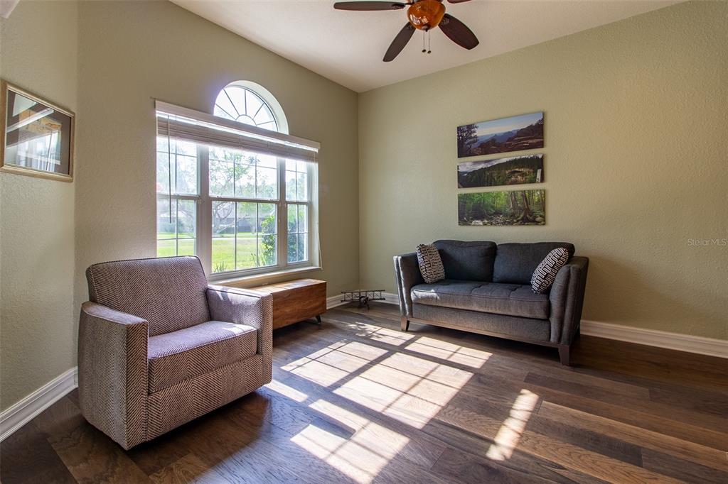 8950 Southeast 17th Court Ocala, FL 34480 - Photo 5 of 61 a living room with furniture and a window