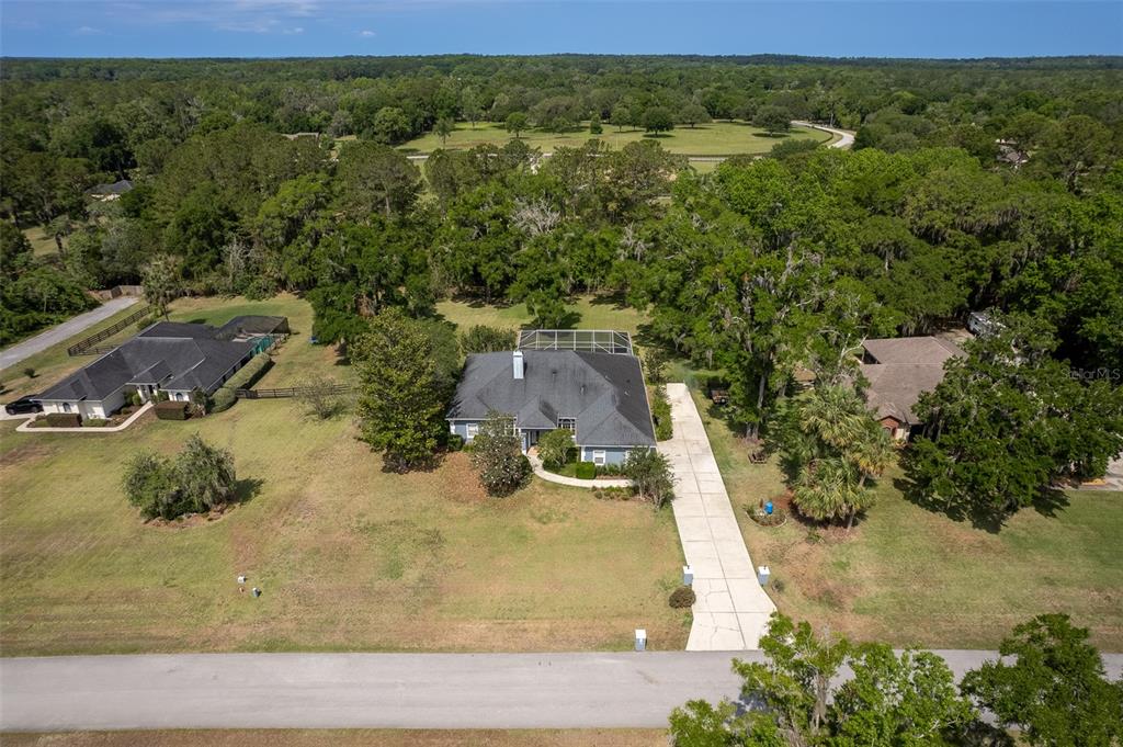 8950 Southeast 17th Court Ocala, FL 34480 - Photo 53 of 61 an aerial view of residential houses with outdoor space and trees