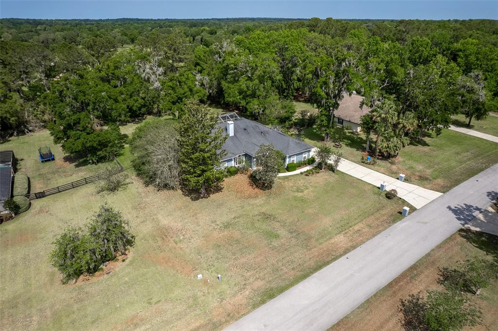 8950 Southeast 17th Court Ocala, FL 34480 - Photo 54 of 61 a view of a yard with an outdoor space