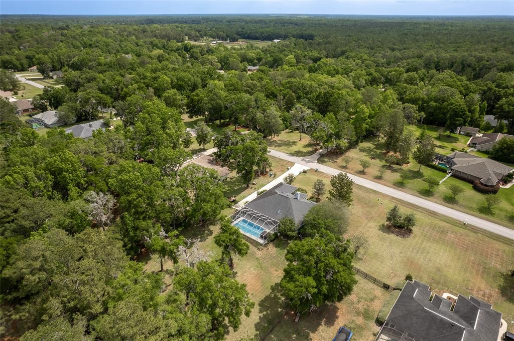 8950 Southeast 17th Court Ocala, FL 34480 - Photo 55 of 61 an aerial view of residential houses with outdoor space and trees