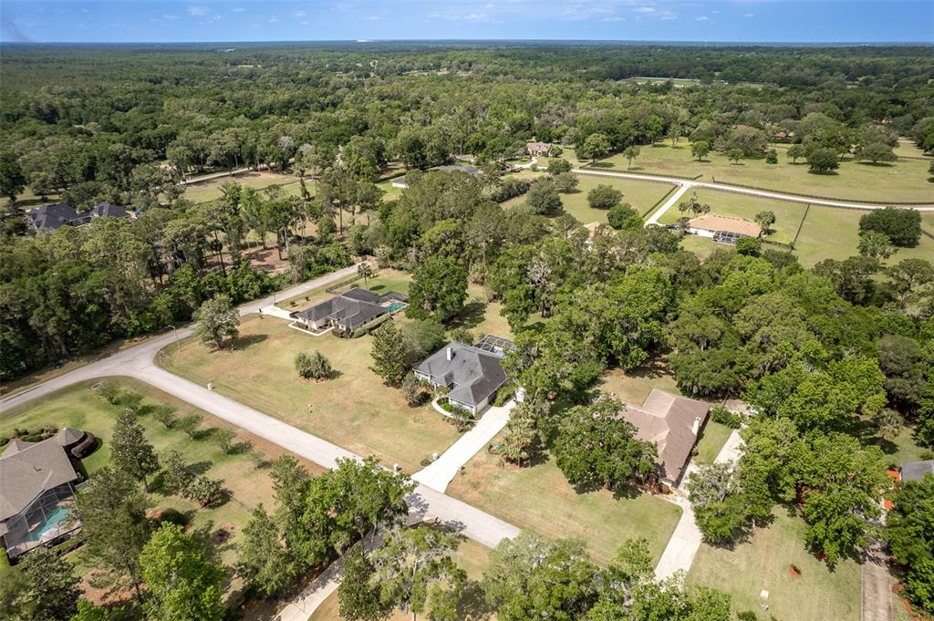8950 Southeast 17th Court Ocala, FL 34480 - Photo 57 of 61 an aerial view of a house with a yard