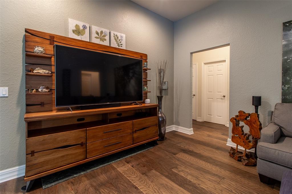 8950 Southeast 17th Court Ocala, FL 34480 - Photo 10 of 61 a living room with furniture flat screen tv and a couch