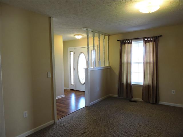 1406 Mud Creek Road Morrison, TN 37357 - Photo 3 of 20 a view of a hallway with wooden floor and windows