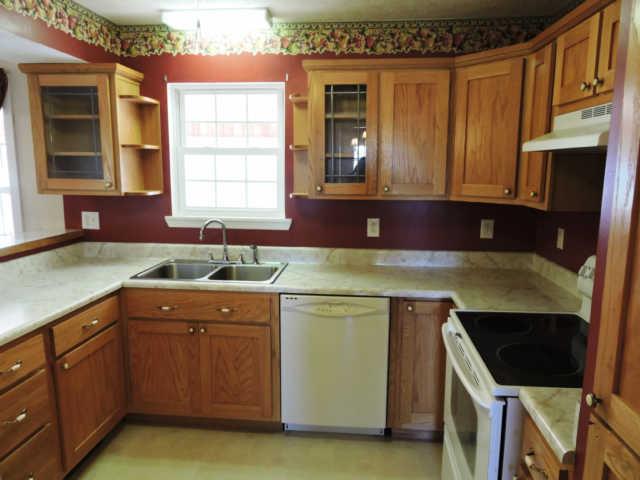 1406 Mud Creek Road Morrison, TN 37357 - Photo 5 of 20 a kitchen with a sink stove and cabinets