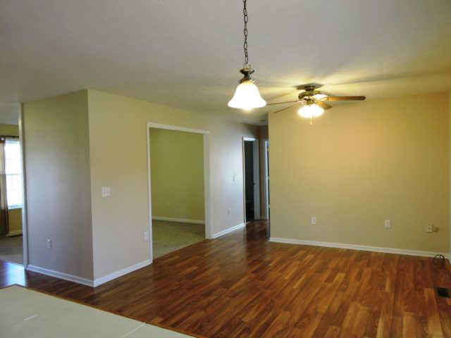 1406 Mud Creek Road Morrison, TN 37357 - Photo 6 of 20 a view of a room with a chandelier fan and wooden floor