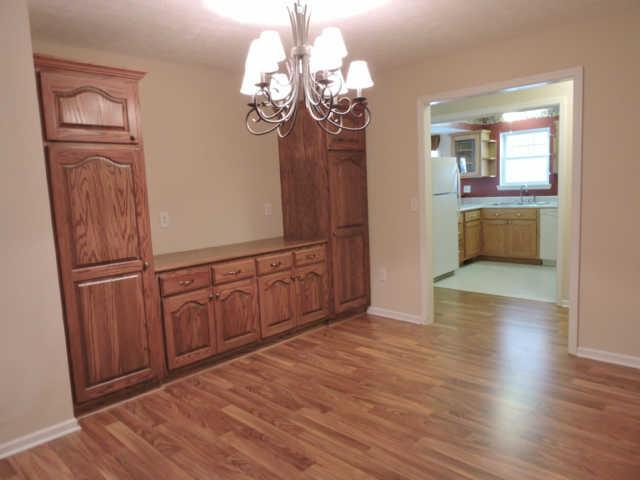 1406 Mud Creek Road Morrison, TN 37357 - Photo 7 of 20 a view of a kitchen with cabinet and wooden floor
