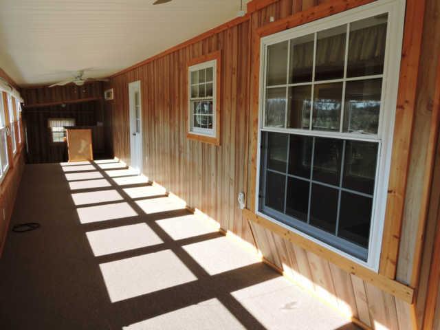 1406 Mud Creek Road Morrison, TN 37357 - Photo 10 of 20 a view of a balcony with a couple of table and chairs