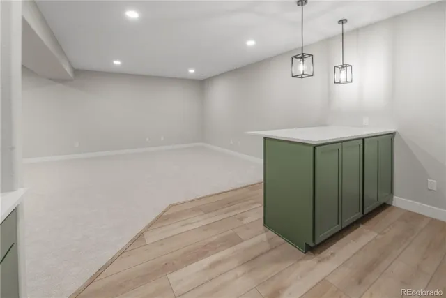a view of a storage & utility room with wooden floor