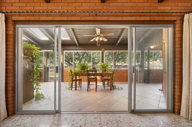 a view of a chairs and table in the balcony