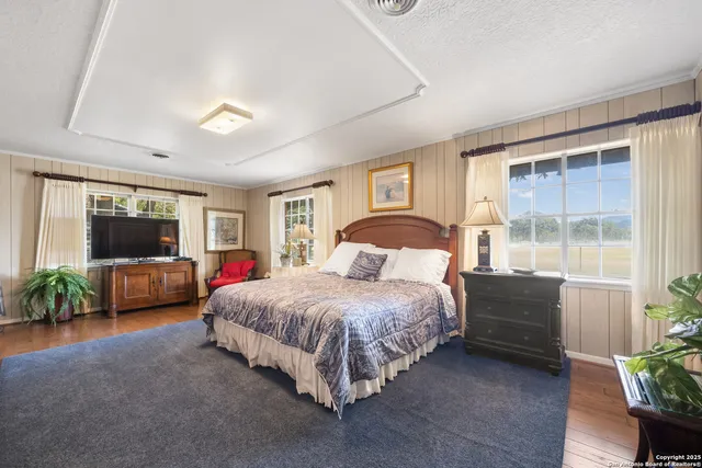 a view of a park with bench and trees