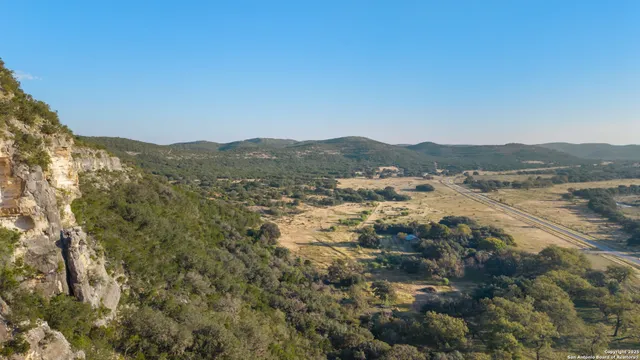 a view of a houses with a forest