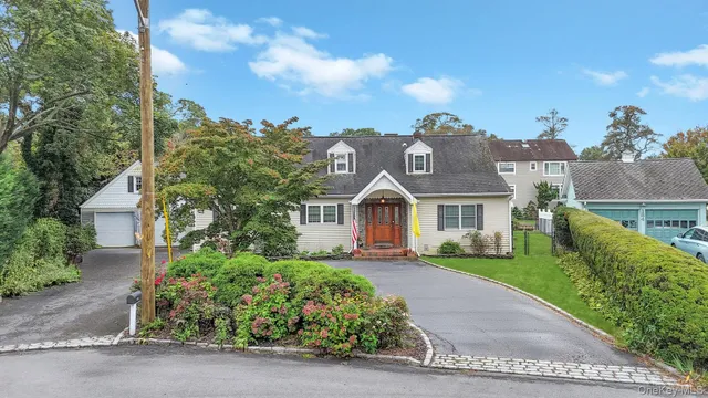 front view of a house with a garden
