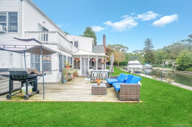 a swimming pool with outdoor seating and garden