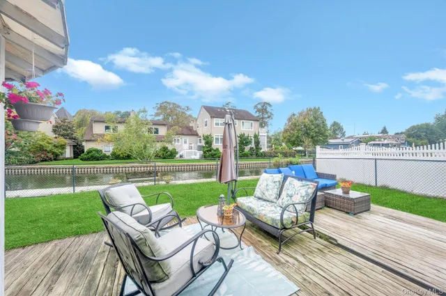 a view of a patio with couches chairs and a table