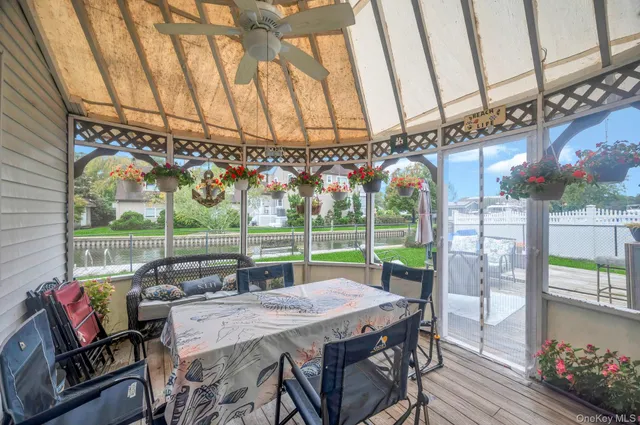 a view of a patio with a table and chairs