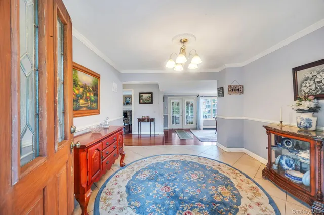 a living room with furniture windows and wooden floor