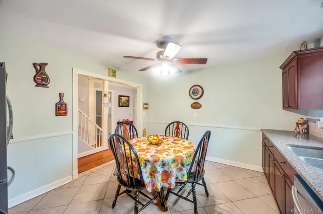 a dining room with furniture and chandelier