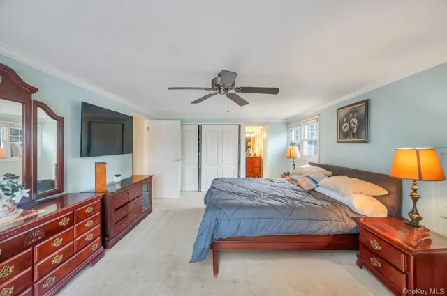 a bedroom with bed and window with window