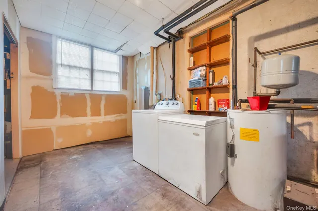 a bathroom with a tub a sink and a large window