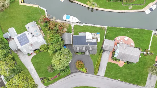 an aerial view of a house with outdoor space swimming pool