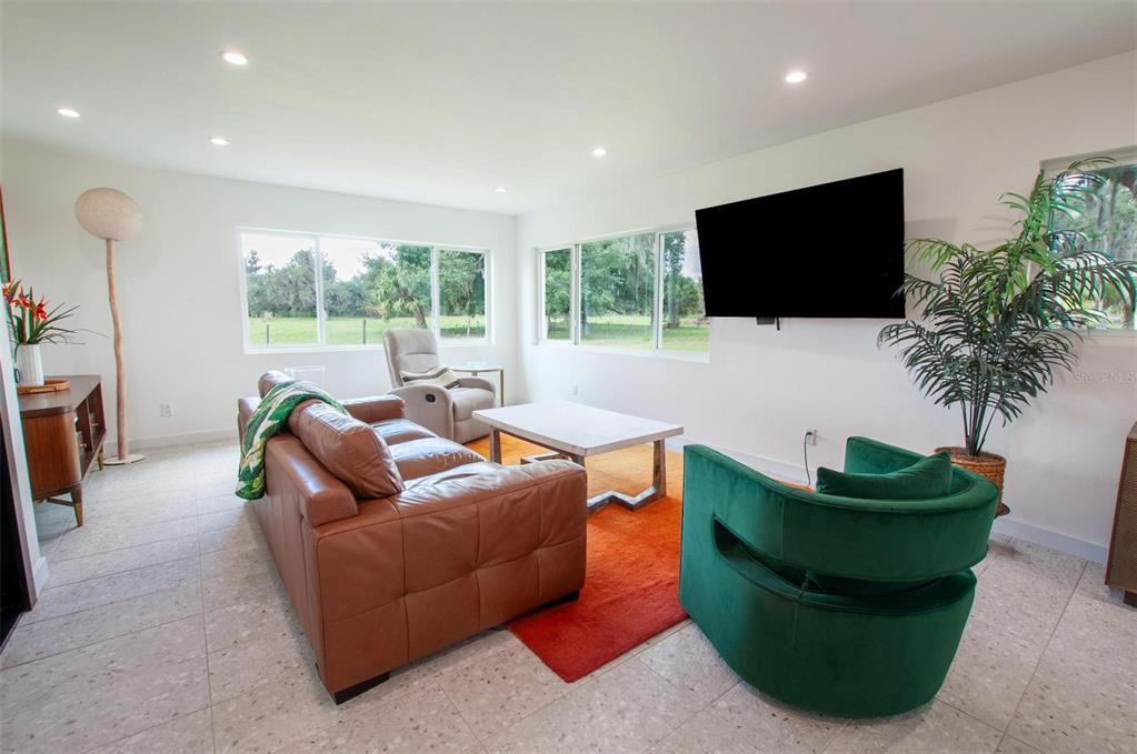 1635 Southwest Rodgers Avenue Arcadia, FL 34266 - Photo 7 of 32 a living room with furniture and a flat screen tv