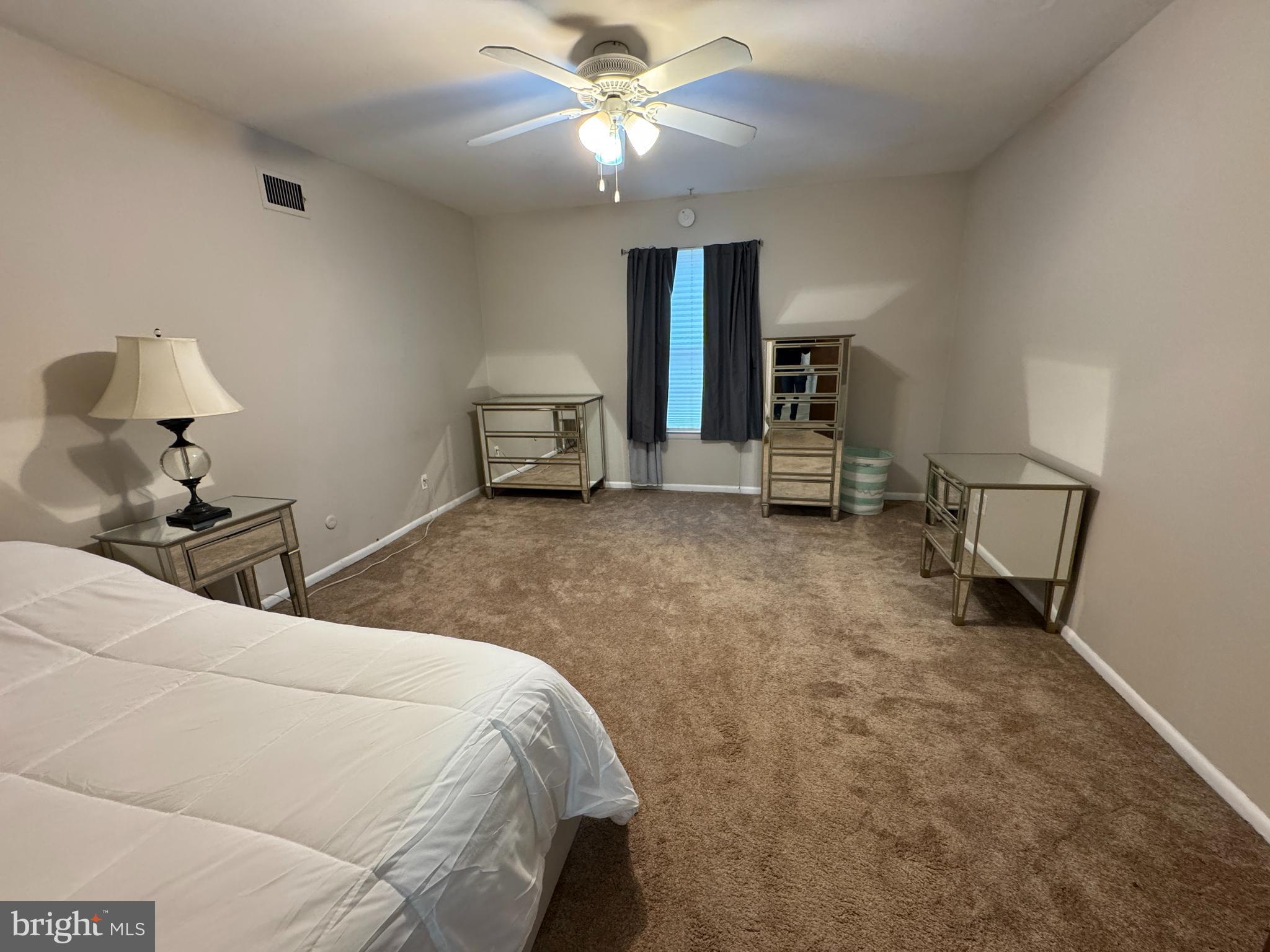 307 Drummers Lane Wayne, PA 19087 - Photo 12 of 16 a bedroom with a bed and a chandelier
