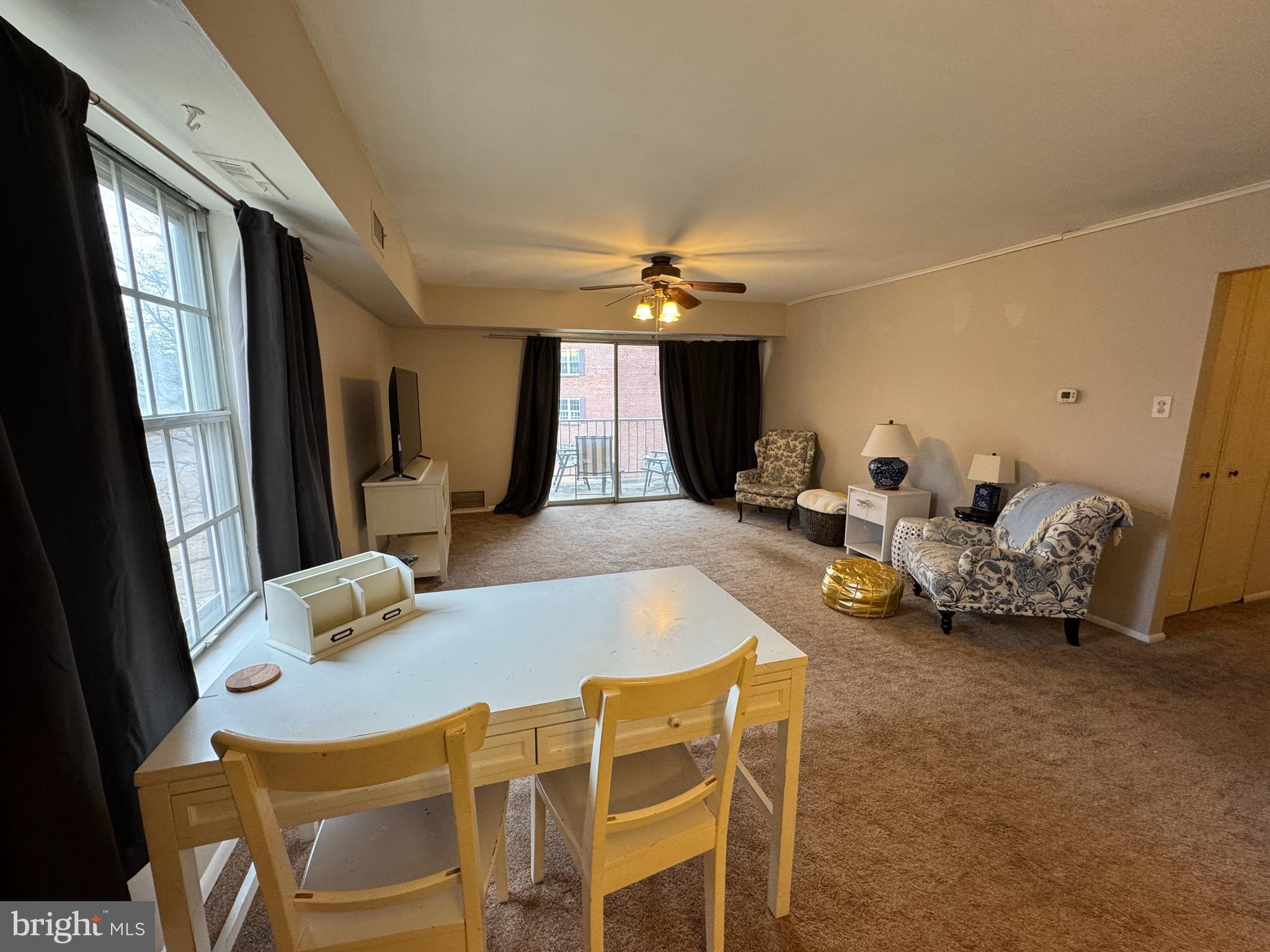 307 Drummers Lane Wayne, PA 19087 - Photo 7 of 16 a living room with furniture and a large window