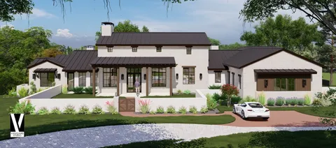 a aerial view of a house with a yard and a fountain