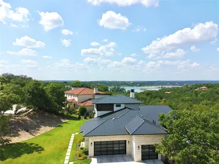 a view of swimming pool with outdoor seating and plants