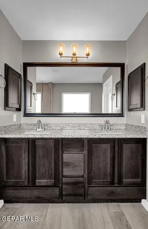 a bathroom with a sink and a mirror