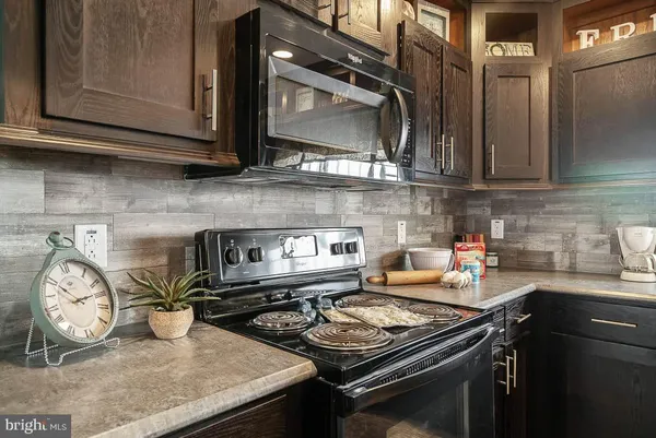 a kitchen with a stove and a microwave