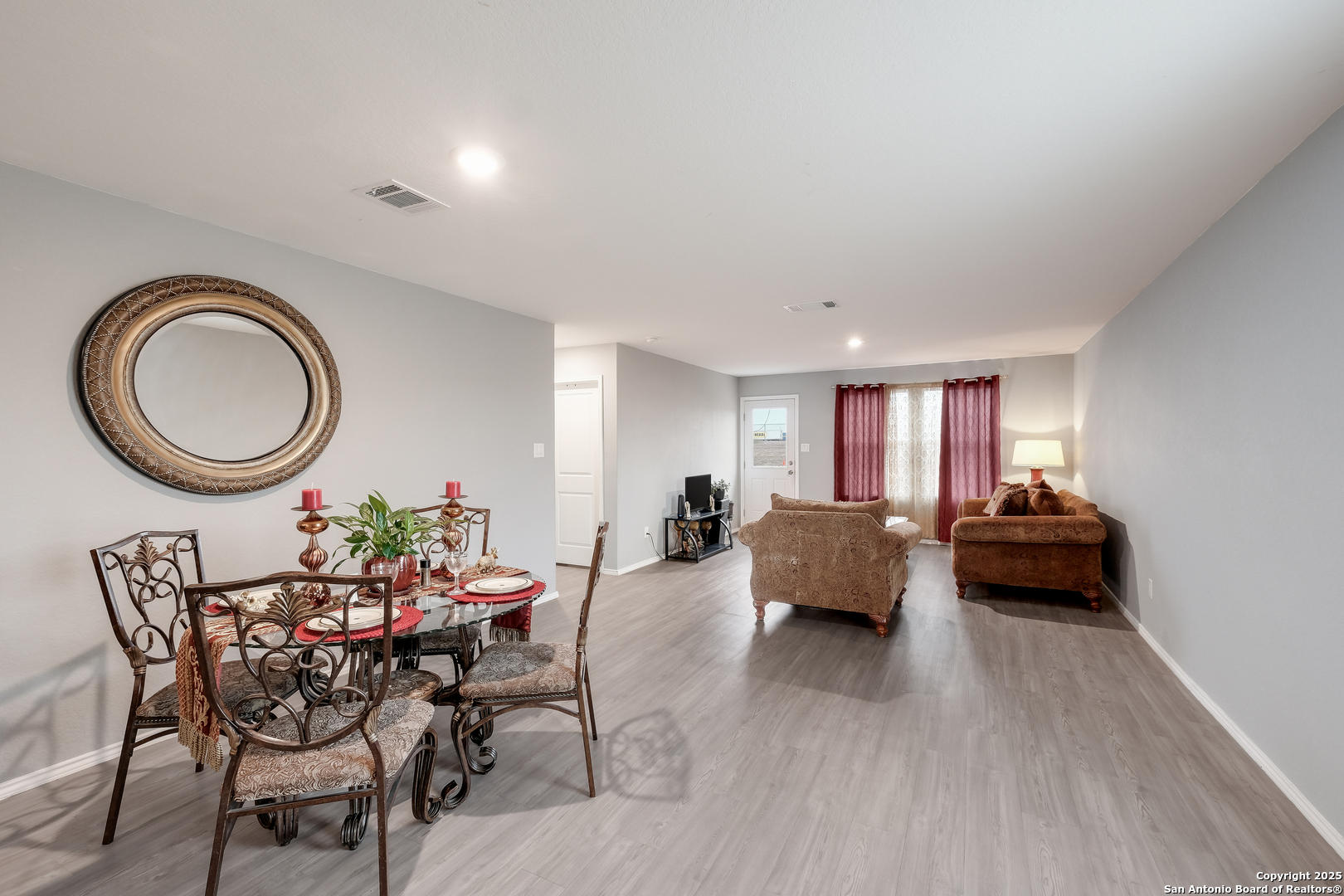 706 Ambush Ridge San Antonio, TX 78220 - Photo 9 of 21 a living room with furniture and a wooden floor