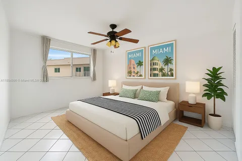 a bedroom with a bed and a potted plant