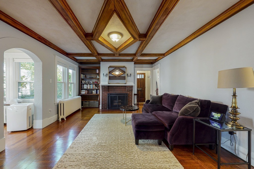 15 Sunset Road, Unit 15 Watertown, MA 02472 - Photo 11 of 25 a living room with furniture and a fireplace