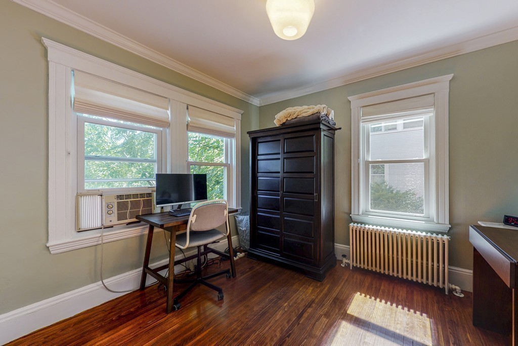 15 Sunset Road, Unit 15 Watertown, MA 02472 - Photo 13 of 25 a workspace with wooden floor and a window
