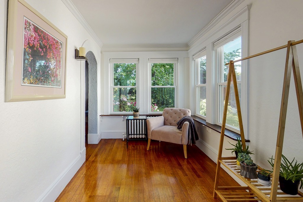 15 Sunset Road, Unit 15 Watertown, MA 02472 - Photo 15 of 25 a living room with furniture and a large window