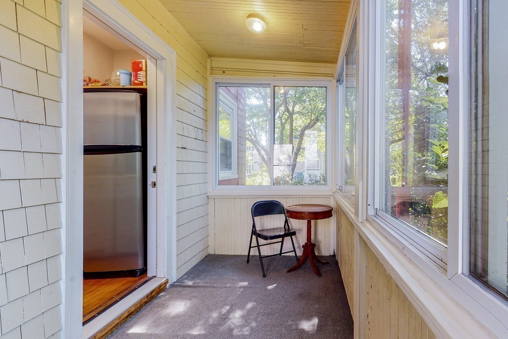 15 Sunset Road, Unit 15 Watertown, MA 02472 - Photo 20 of 25 a balcony with chairs and a table