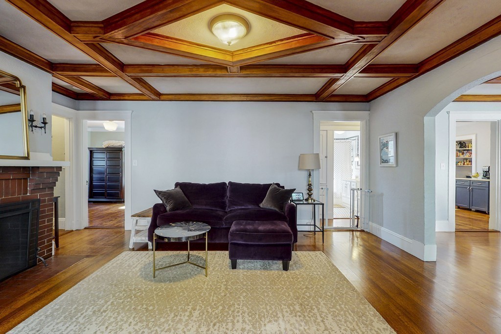 15 Sunset Road, Unit 15 Watertown, MA 02472 - Photo 6 of 25 a living room with furniture and a wooden floor