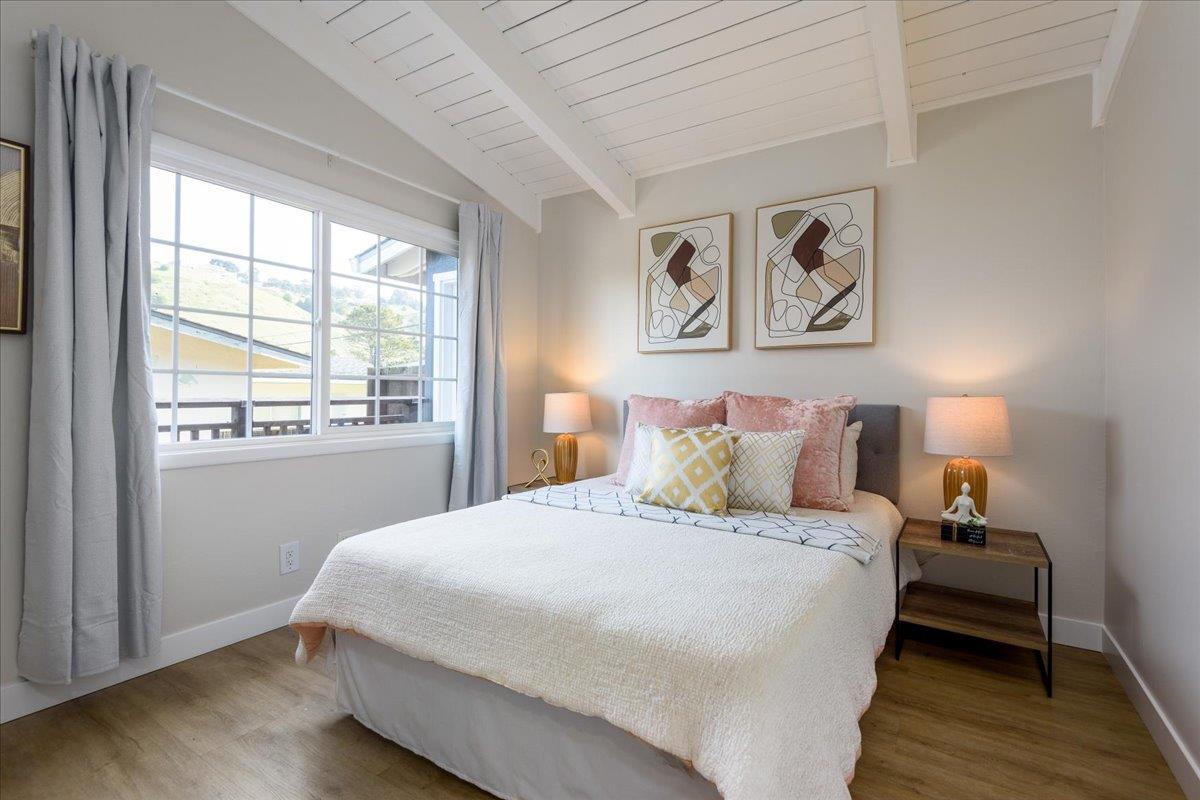 815 Edgemar Avenue Pacifica, CA 94044 - Photo 11 of 27 a bedroom with a bed and a window
