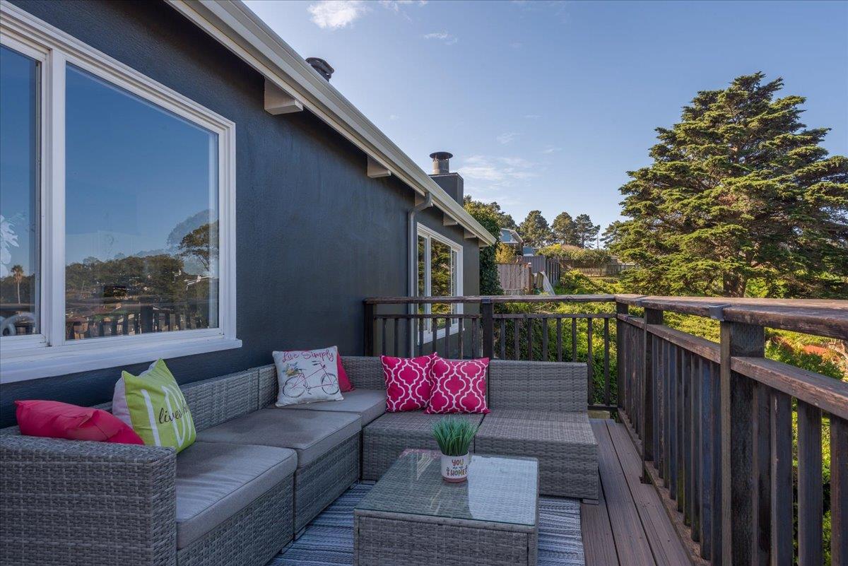 815 Edgemar Avenue Pacifica, CA 94044 - Photo 15 of 27 a balcony with furniture and wooden floor
