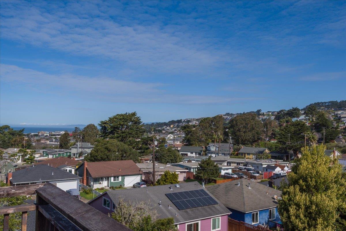 815 Edgemar Avenue Pacifica, CA 94044 - Photo 16 of 27 a view of a city from a terrace