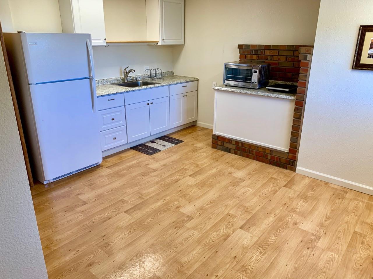 815 Edgemar Avenue Pacifica, CA 94044 - Photo 21 of 27 a kitchen with granite countertop a refrigerator stove and sink